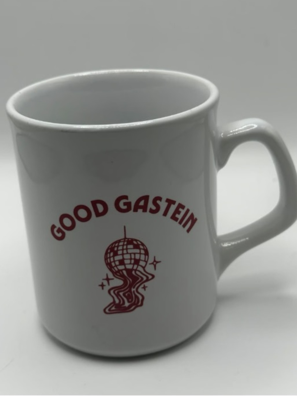 White Ceramic Mug with Red 'GOOD GASTEIN' Graphic